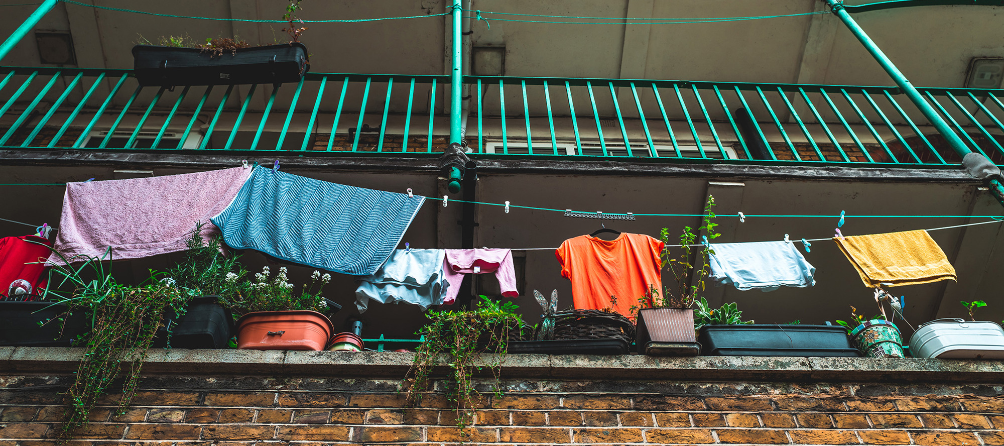 Washing hanging out to dry on a balcony.