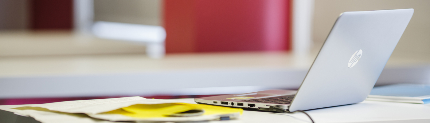 laptop on a table at a conference