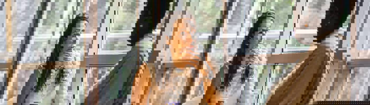 two people sat at a table talking